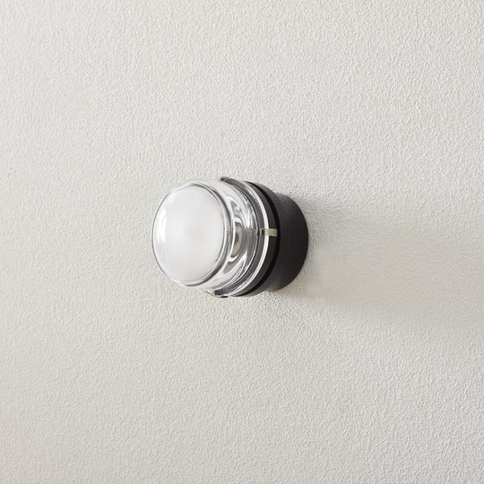 Oluce Fresnel - vägglampa med glaslins IP44 svart