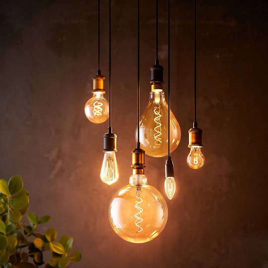 Philips LED-lampa E27 A60 5,5W 2000K guld dimbar